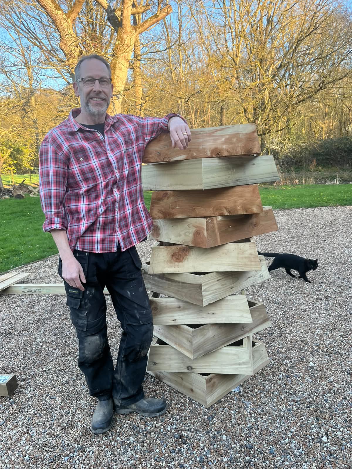 Bee Tidy handcrafted hive storage in a garden setting