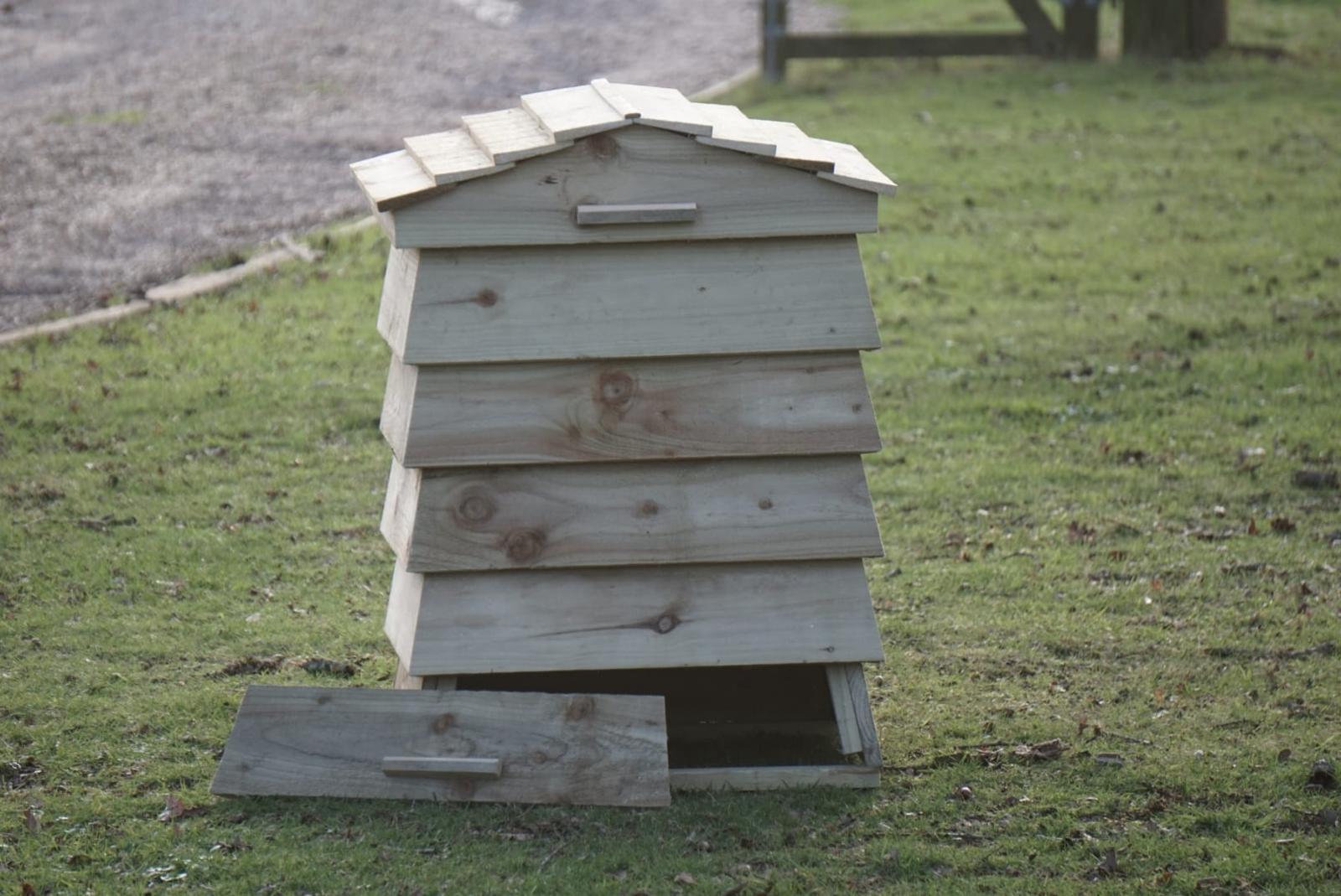 Beehive Composter in a vegetable garden setting
