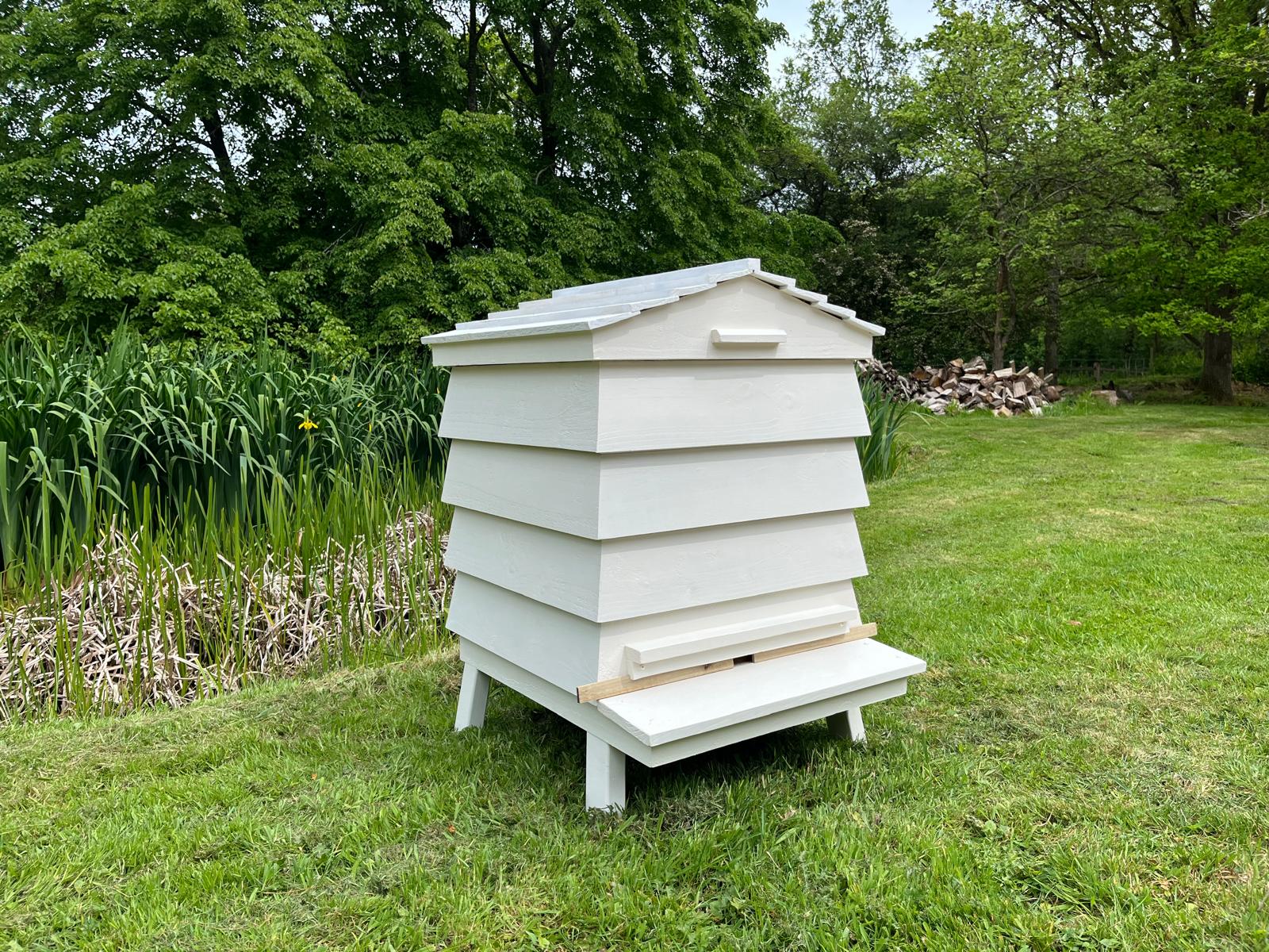 Bespoke Bee Tidy hive raised on stilt feet for a refined garden placement
