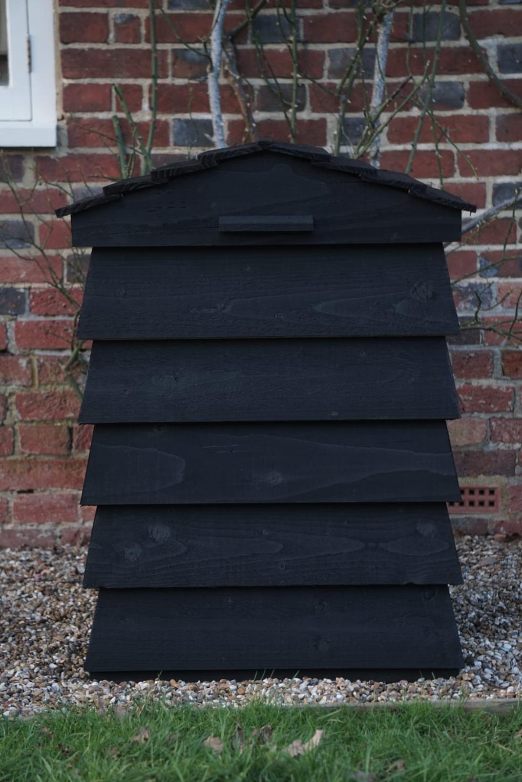 Close-up of the parcel box timber lid and secure delivery opening