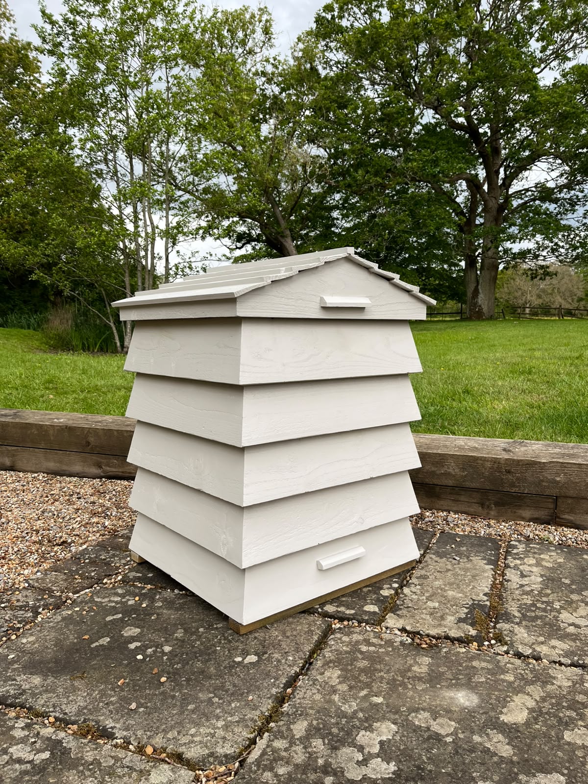 Patio Hive positioned on paving as outdoor cushion and toy storage