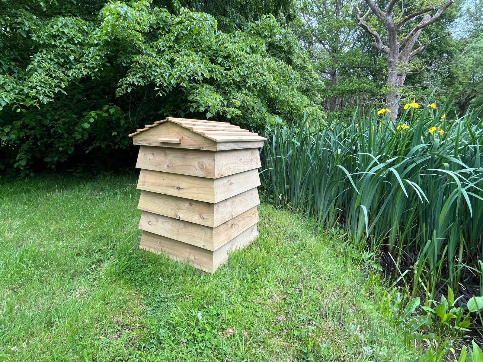 Wide view of the Garden Paraphernalia Box blending into a garden border