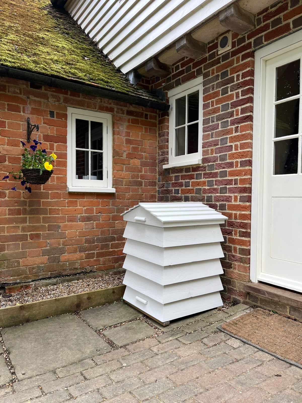 Welly Boot Hive for outdoor footwear storage beside the home